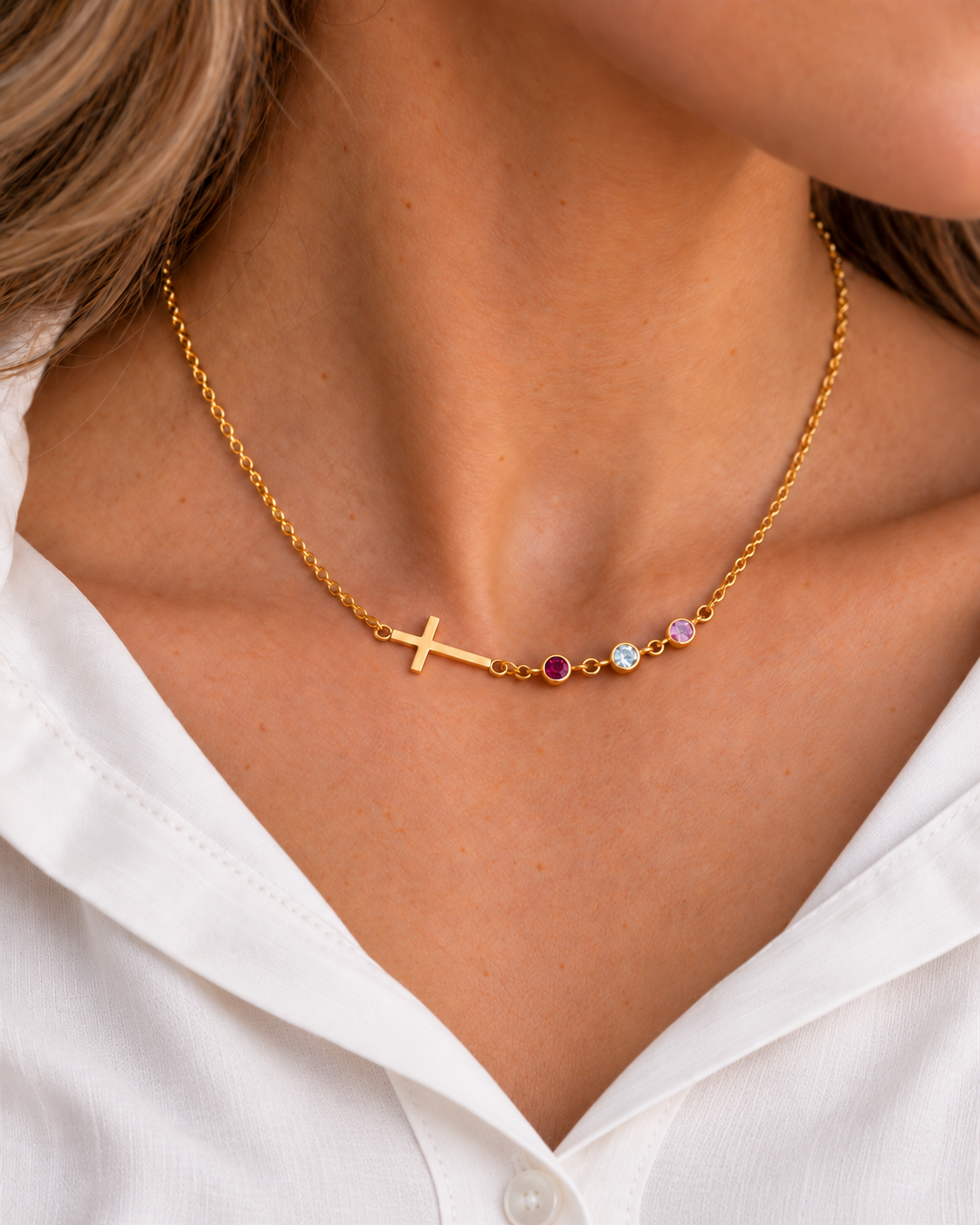 Inès Cross Birthstone Necklace in gold worn on model — small stones view