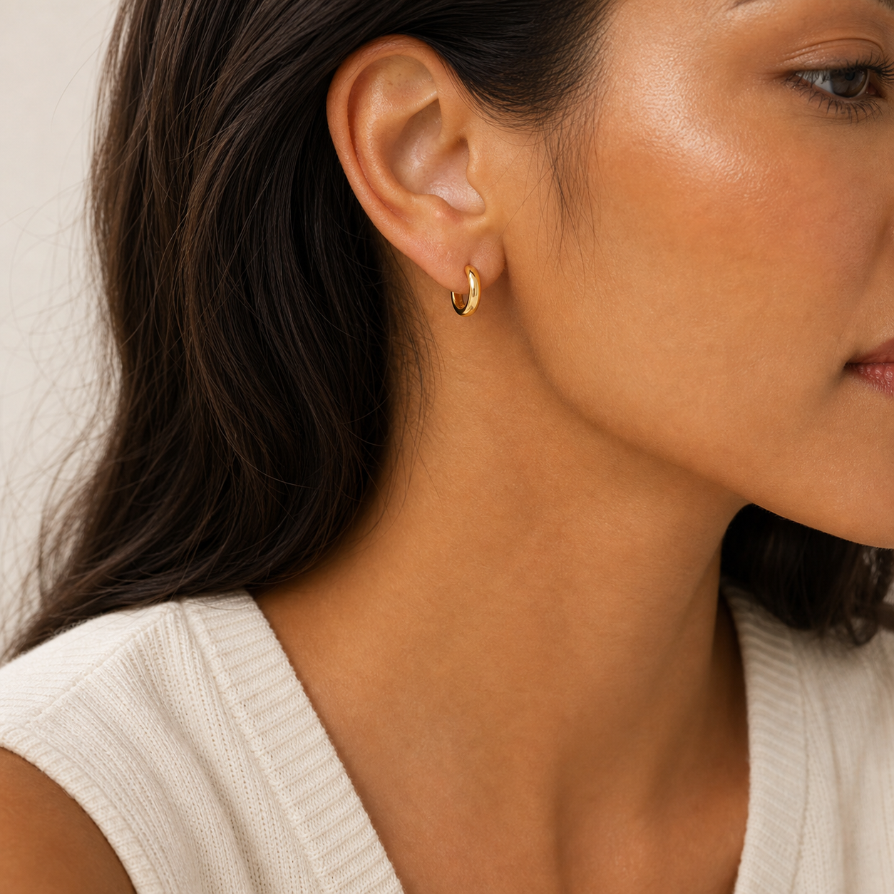 Solene Tiny Huggie Hoop Earrings model gold by SURI