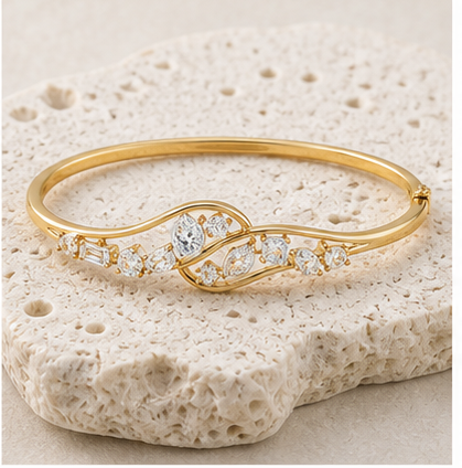 Seraphine Swirl Diamond Bangle rock gold by SURI