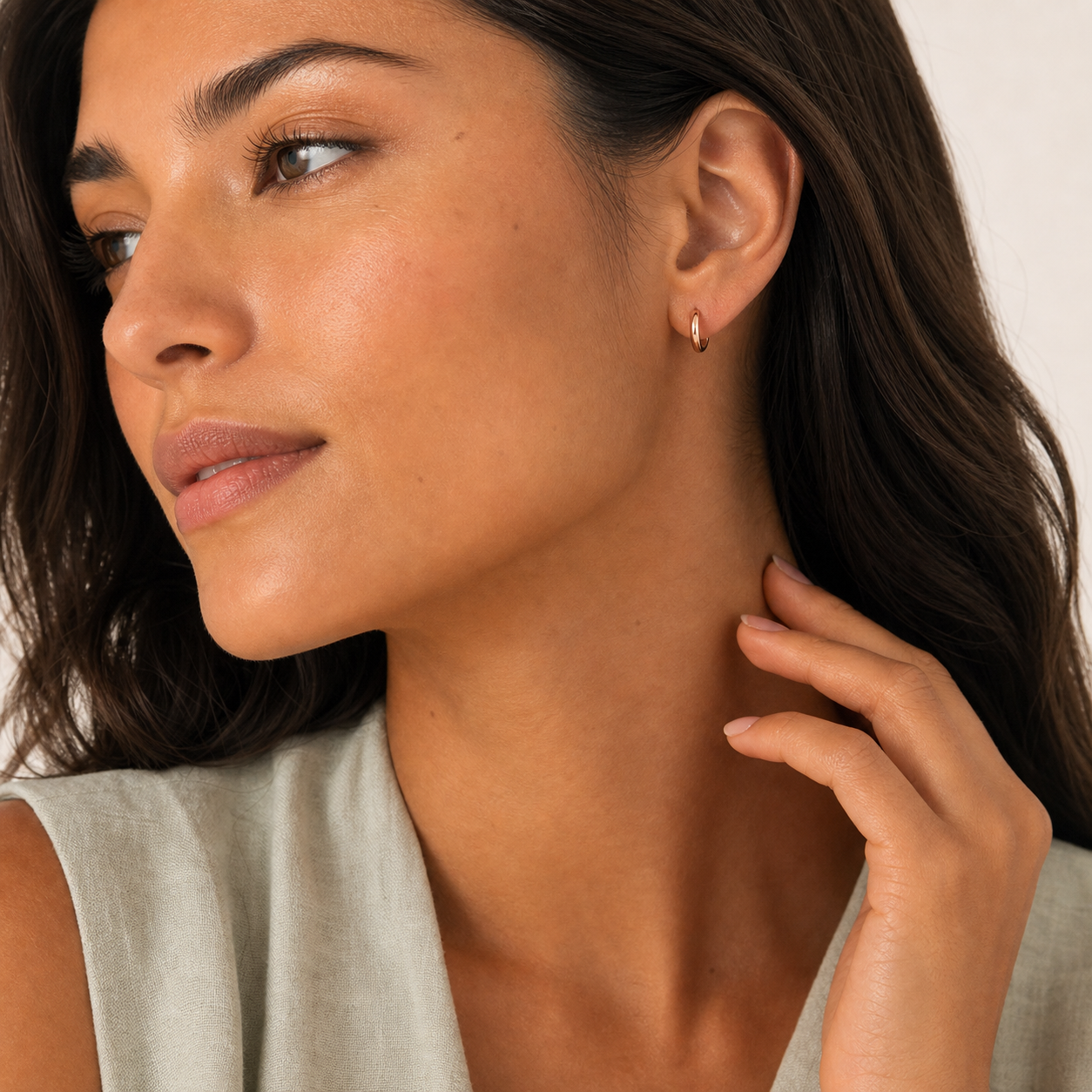 Solene Tiny Huggie Hoop Earrings model rose by SURI