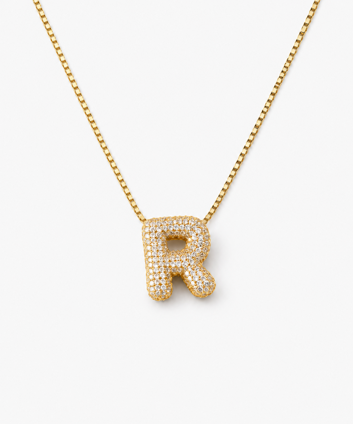 Inori Pavé Initial Necklace — gold on white/gray background