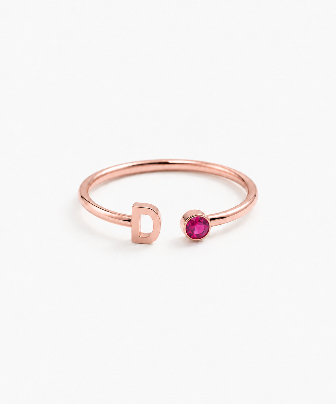 Isola Initial Birthstone Ring in rose gold on white background