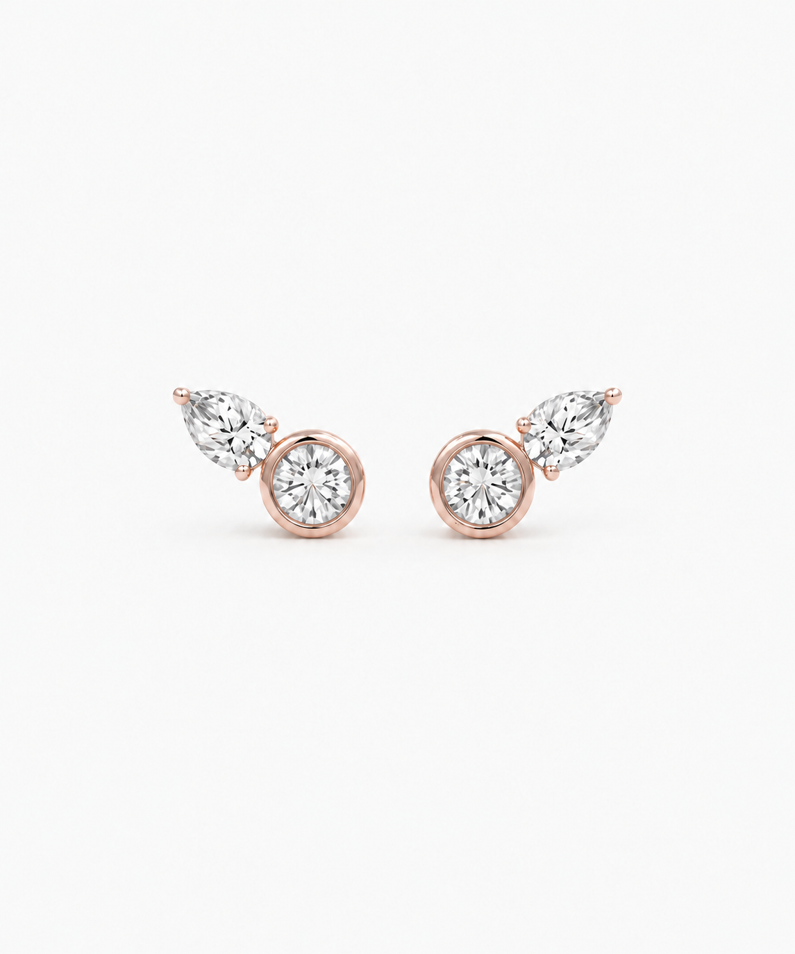 Coria Bezel Stud Earrings in rose gold on white background