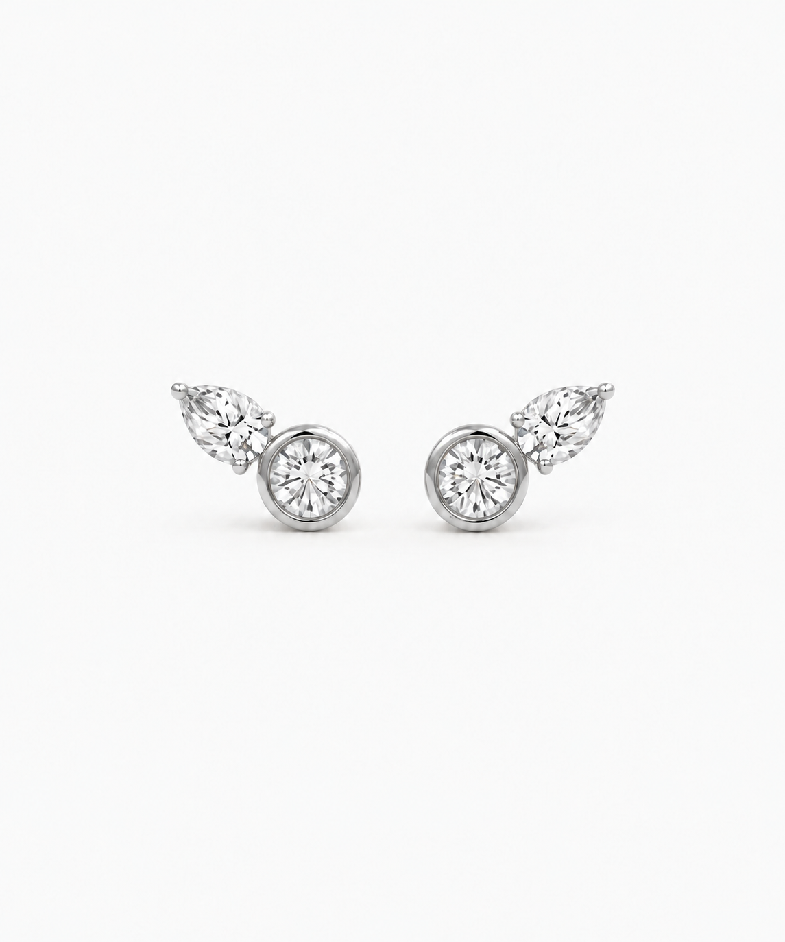 Coria Bezel Stud Earrings in silver on white background