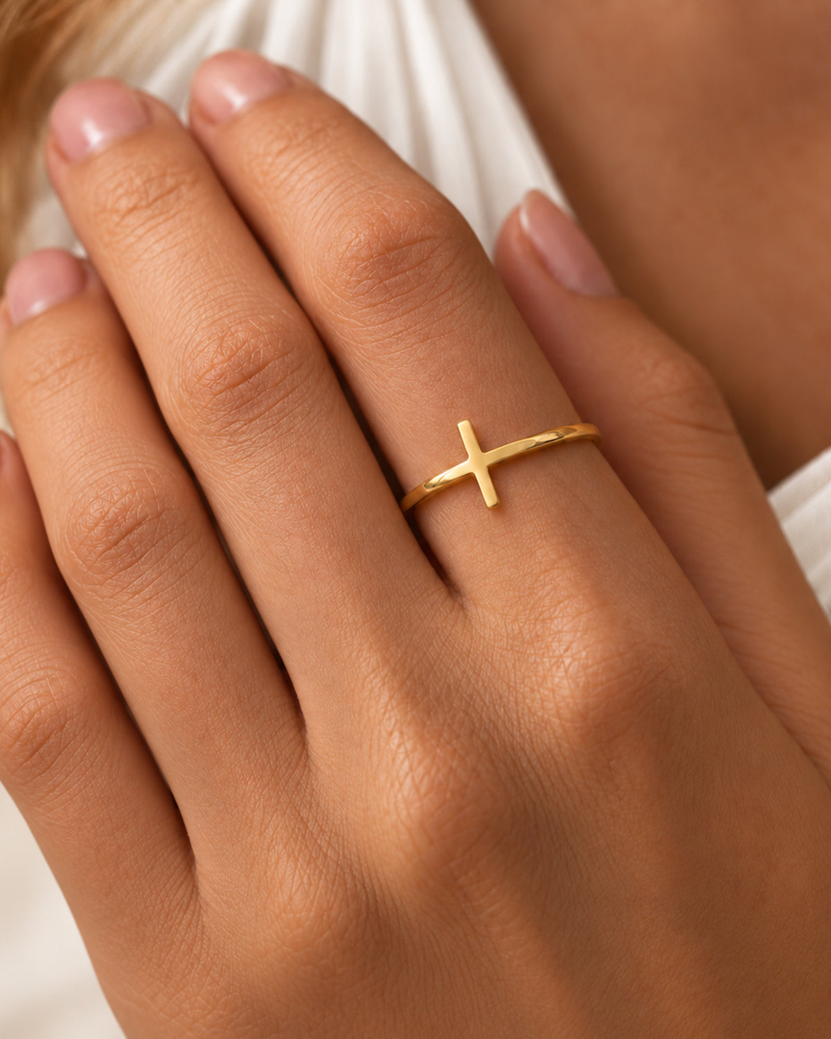 Amélie Cross Ring in gold worn on model — view 1