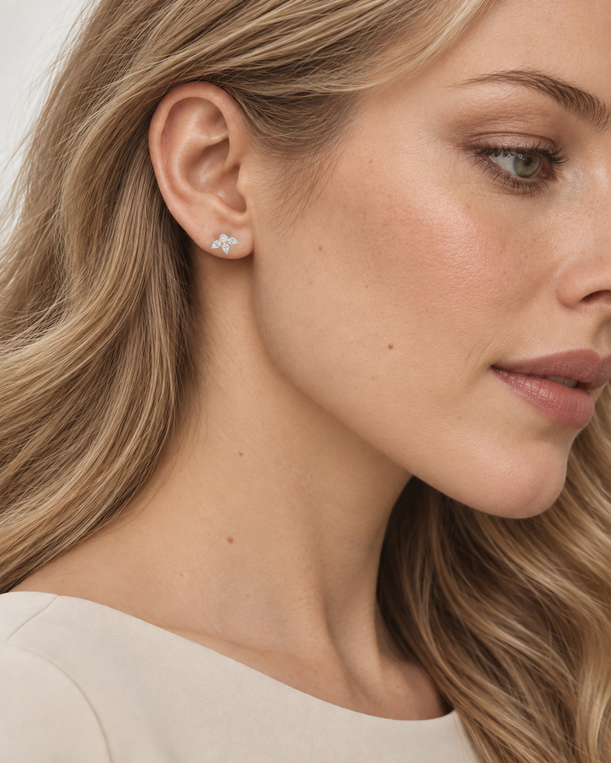Camille Pear-Cut Stud Earrings in rose gold, worn on model