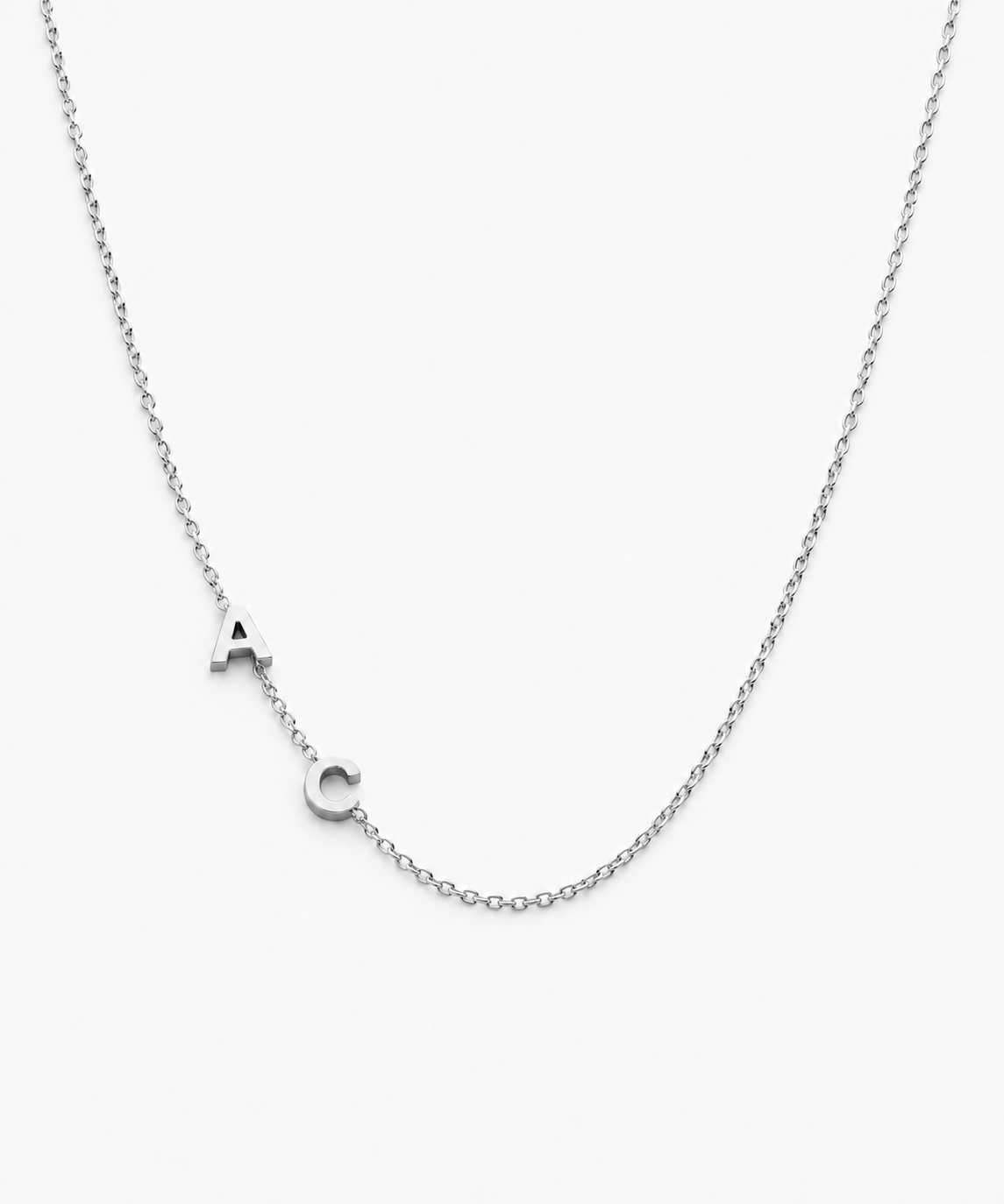 Sumi Sideways Initial Necklace — Silver on white background