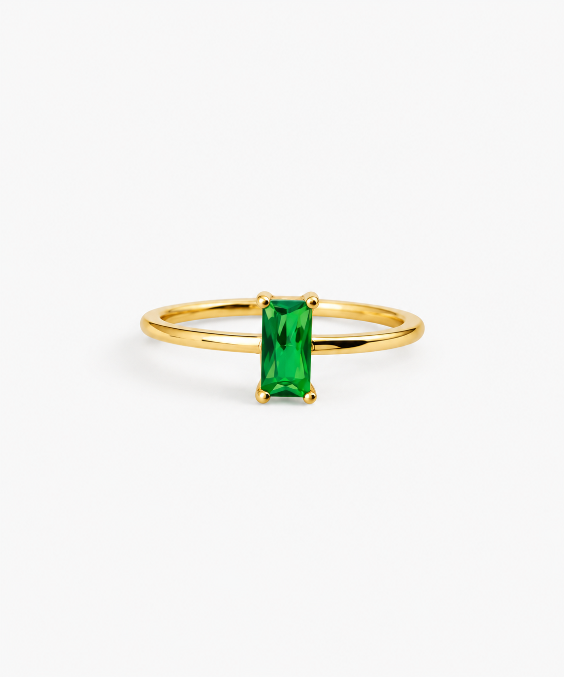 Canara Baguette Emerald Ring in gold on white background