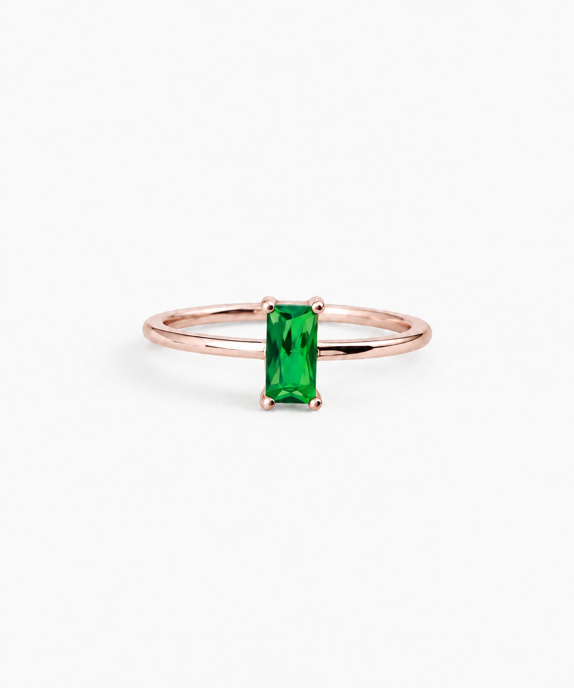 Canara Baguette Emerald Ring in rose gold on white background