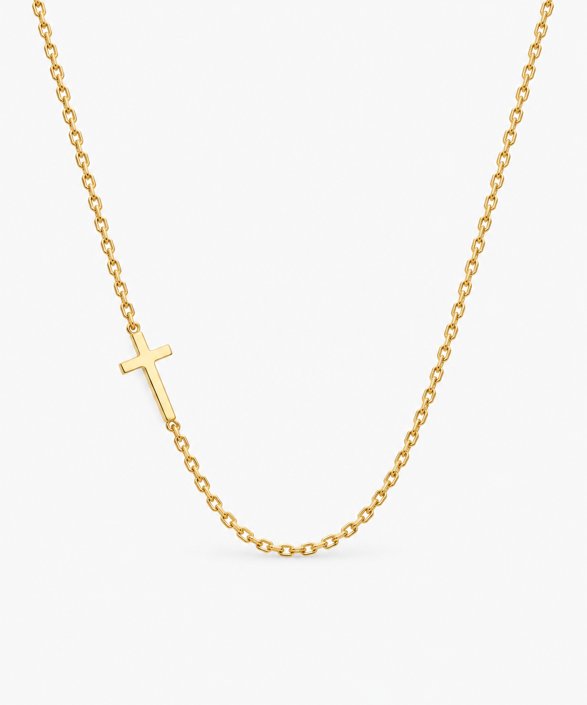 Estelle Sideways Cross Necklace — gold on white/gray background