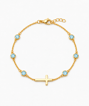 Marina Aquamarine Blue Birthstone Cross Bracelet — Yellow Gold on white background