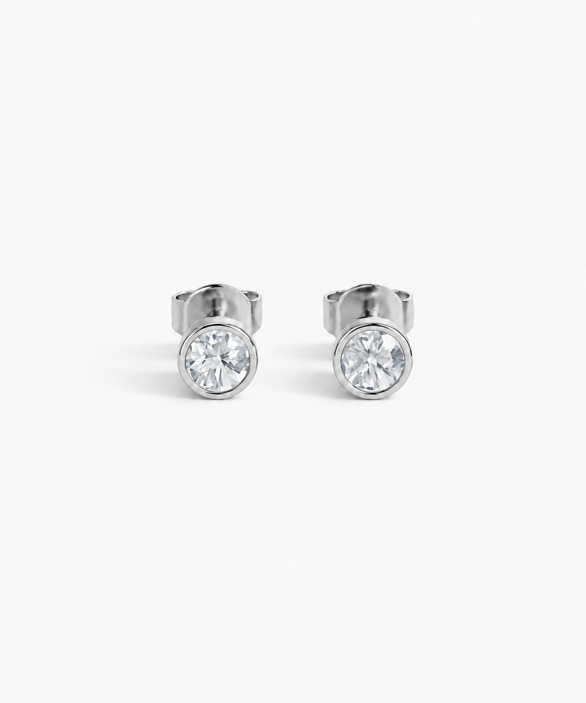 Hana Bezel Stud Earrings in silver on white background