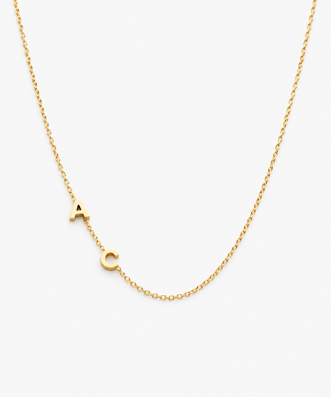 Sumi Sideways Initial Necklace — Yellow Gold on white background