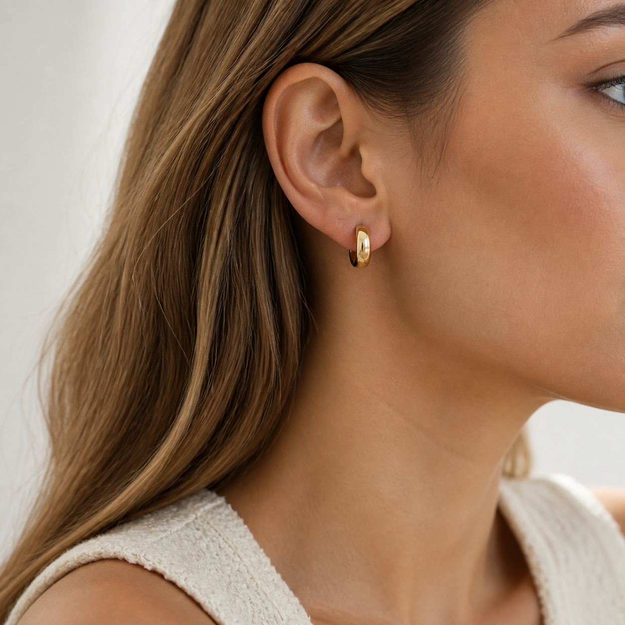Vela Domed Huggie Earrings model 01 by SURI