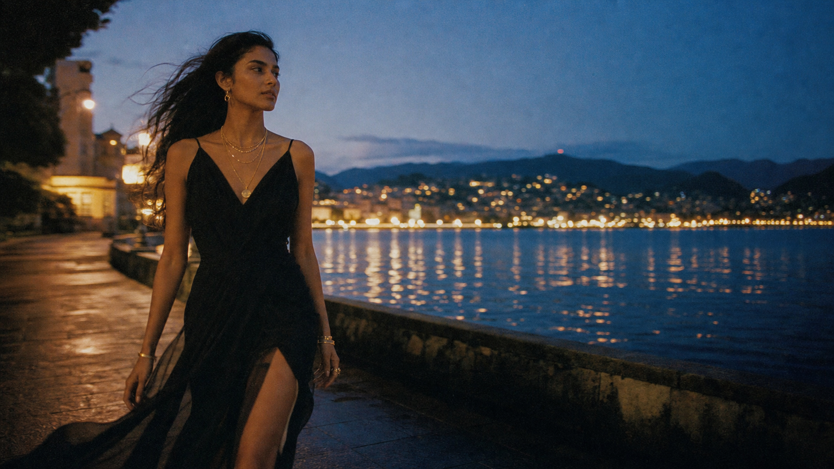 Suri jewelry worn on a lakeside promenade at blue hour on film